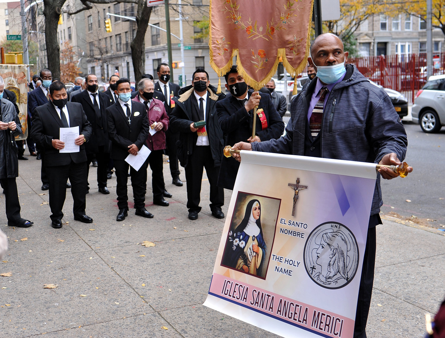 Faithful members of the archdiocesan Holy Name Society’s Hispanic Division gather Nov. 21 before a brief procession outside St. Angela Merici parish in the Bronx for a Mass commemorating the Feast of Christ the King. It was the third annual Mass sponsored by the division.