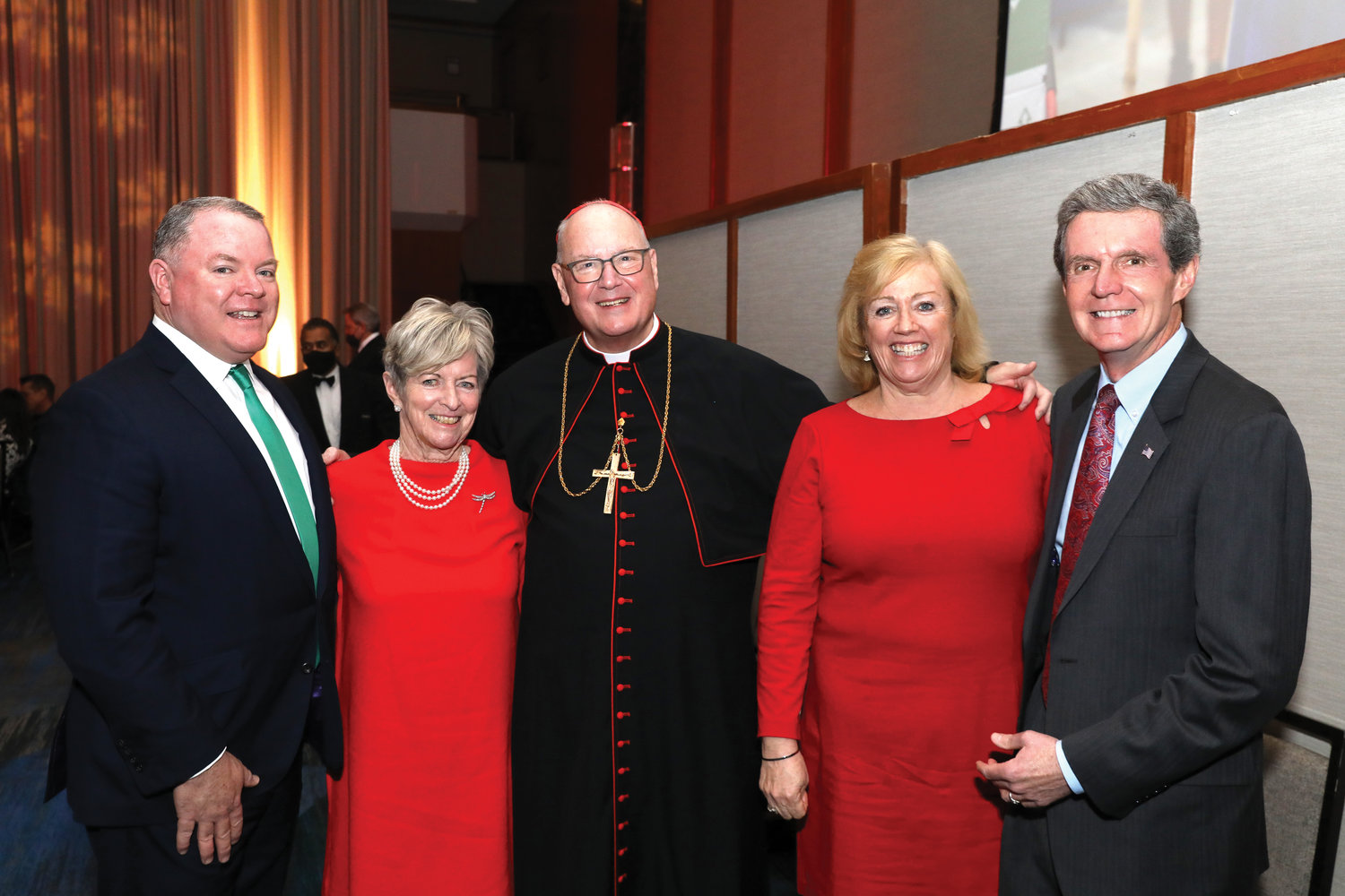 Cardinal Dolan greets honorees at the Cardinal’s Christmas Luncheon Dec. 1 at the New York Hilton Midtown. Second from left was Joan B. O’Connor, who received the Christmas Angel Award, accompanied by her son Bill, and, at right, Kathleen and John McAvoy, who were recognized with the Spirit of St. Nicholas Award.