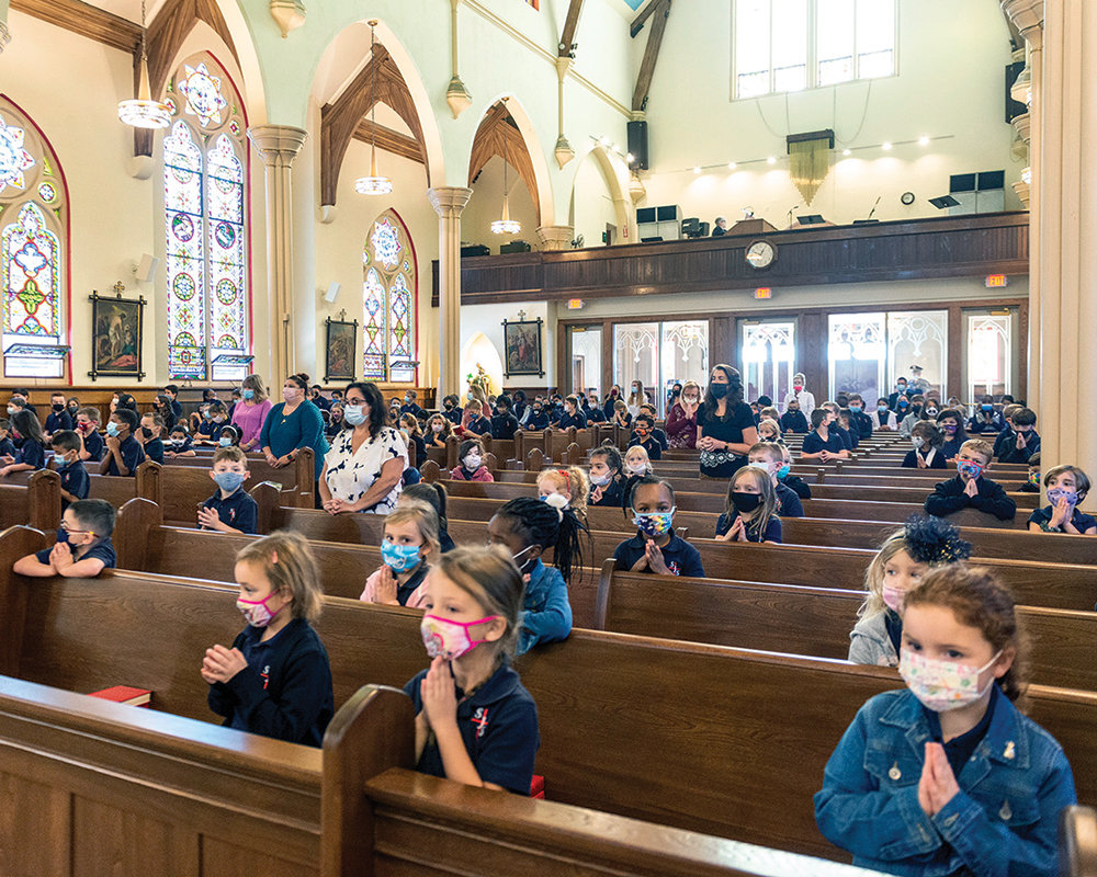 CHURCH MISSION—Cardinal Dolan offered Mass last September for students of St. John’s School in Goshen. Linda Mele Dougherty is the associate superintendent for Catholic identity in the archdiocese.