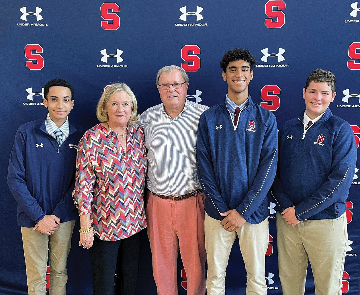 Susan and Dan Mahoney, center, met students from the Stepinac Honors Academy, from left, Calvin Lindo, Nathaniel Alvarez and Lachlan McIntyre at Archbishop Stepinac High School in White Plains. Dan Mahoney, a 1967 Stepinac graduate, and his wife donated $1 million to the school, which will rename its honors academy the Susan and Daniel P. Mahoney Honors Academy.