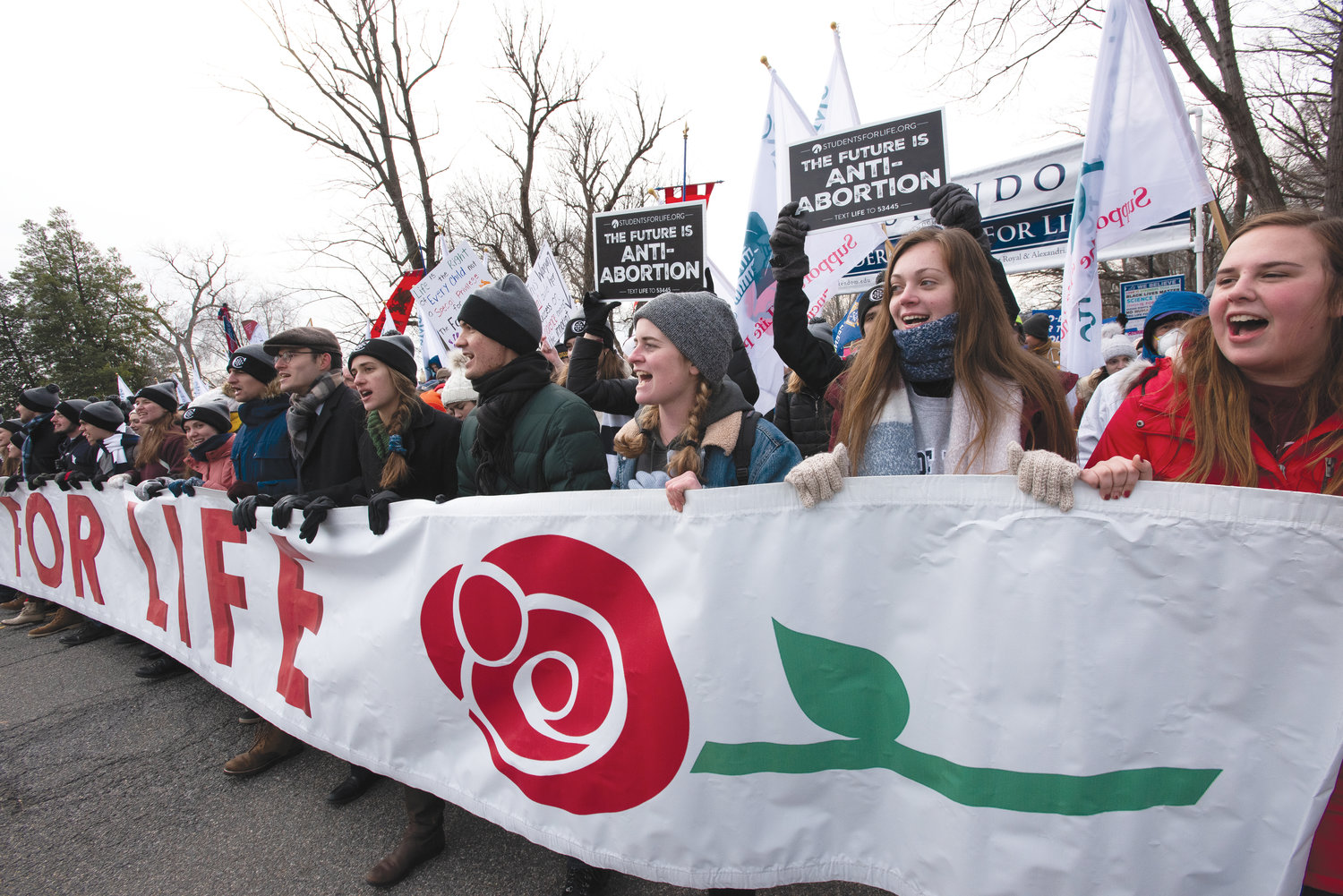 LEADING THE WAY—Enthusiastic young people hold the iconic banner, which traditionally leads the March for Life on Constitution Avenue in Washington, D.C. This year’s 49th annual march took place Jan. 21.