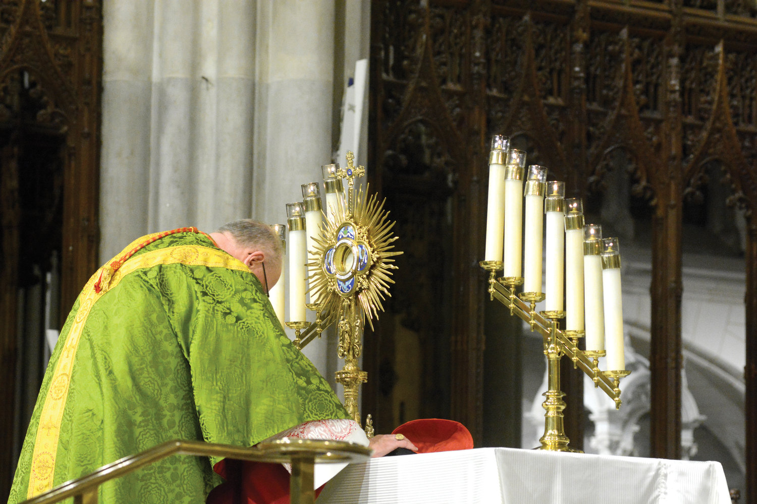 Cardinal Dolan bows in Adoration before the Blessed Sacrament after celebrating Mass Jan. 22, the Day of Prayer for the Legal Protection of Unborn Children, at St. Patrick’s Cathedral. A Holy Hour followed the Mass, which was sponsored by the archdiocesan Respect Life Office.