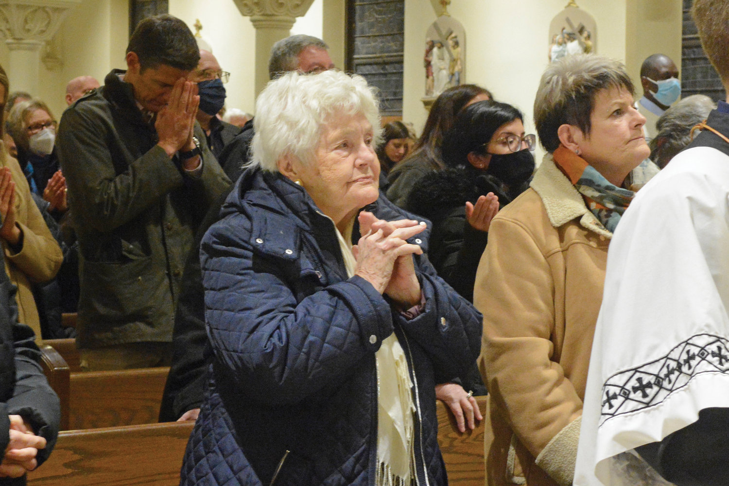Parishioners join in prayer.