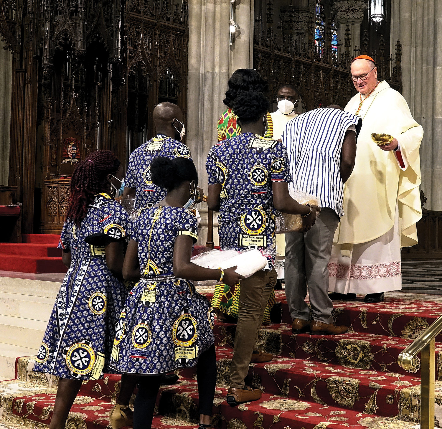 Cardinal Dolan receives the offertory gifts Feb. 6 during the annual Black History Month Mass at St. Patrick’s Cathedral.