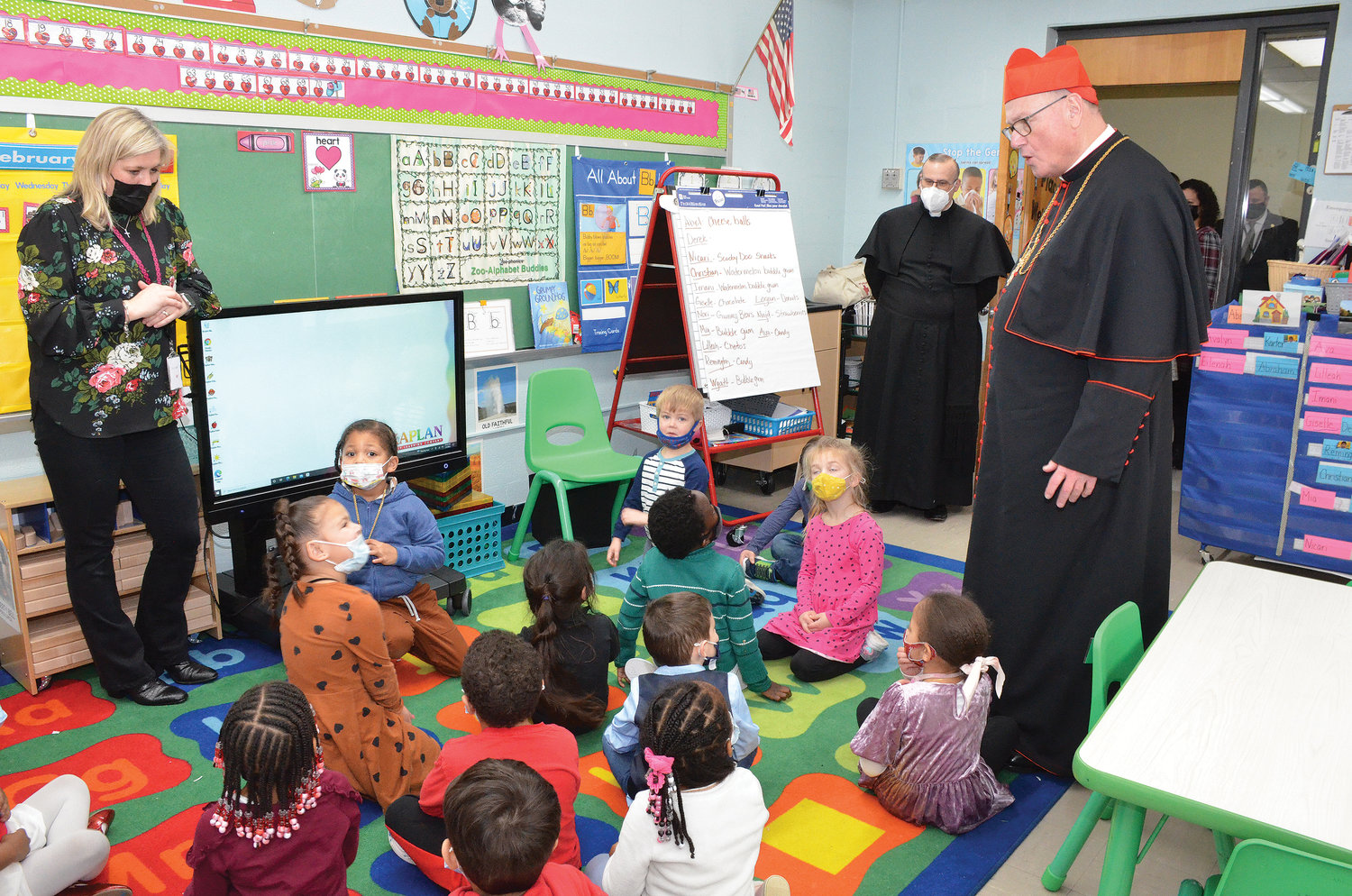 The cardinal greets universal prekindergarten students at Holy Trinity School Annex at St. Peter’s.
