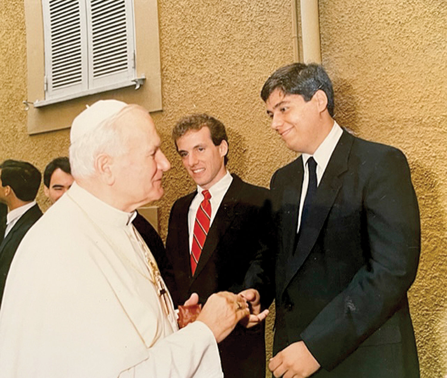 Seminarian John Bonnici, who studied in Rome, graciously greets Pope John Paul II.