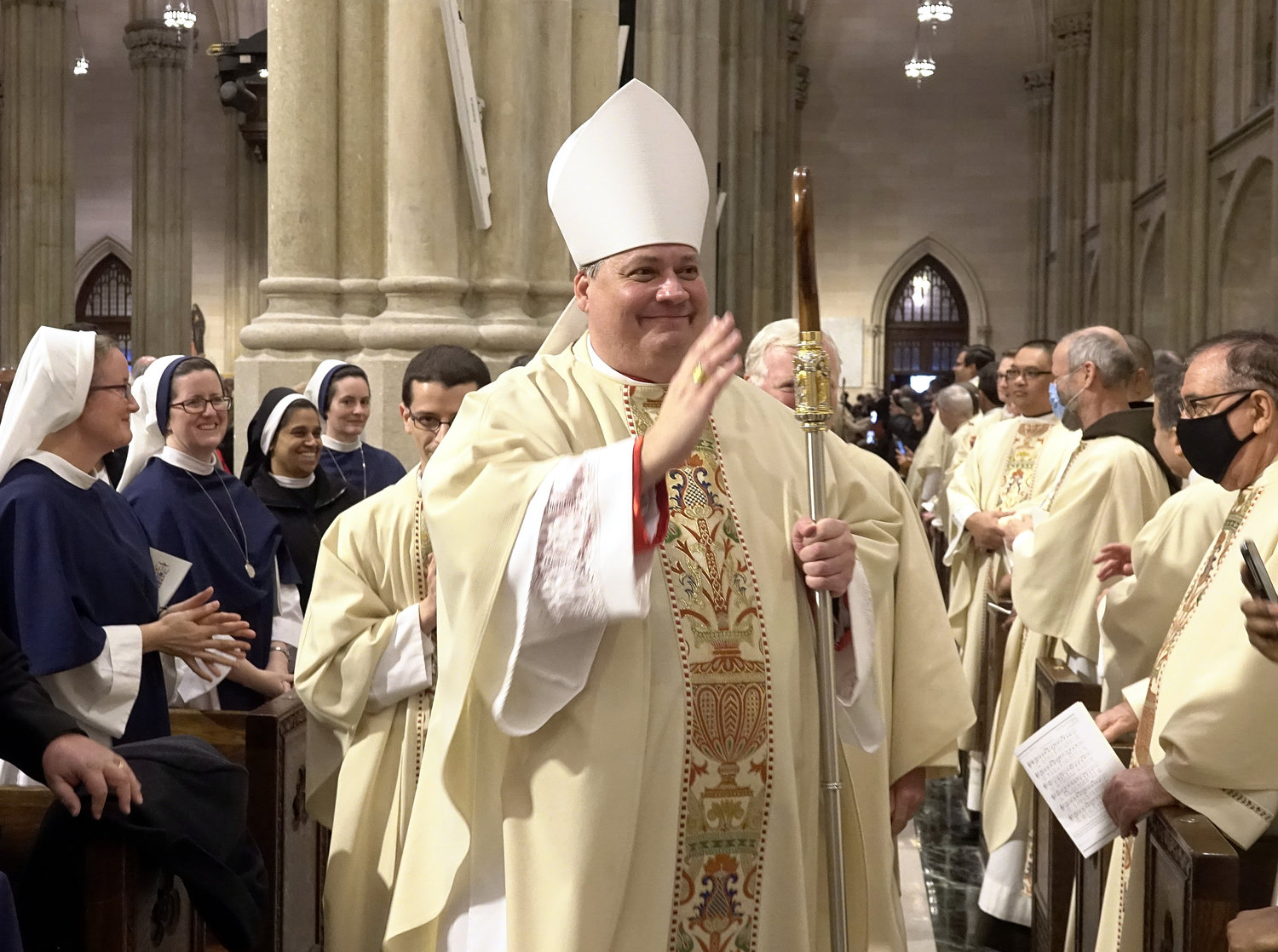 Auxiliary Bishop John S. Bonnici extends his blessing to the congregation.