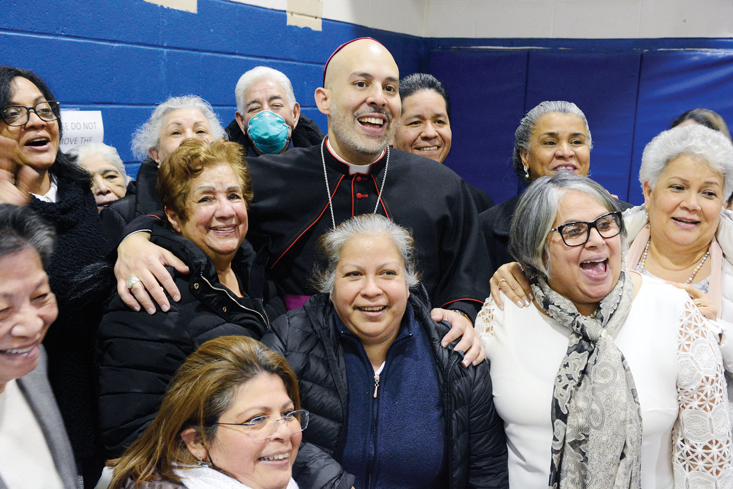 Auxiliary Bishop Joseph Espaillat celebrates his ordination to the episcopacy with those dear to them during a reception at Cathedral High School in the New York Catholic Center in Manhattan following the ordination Mass at St. Patrick’s Cathedral March 1.