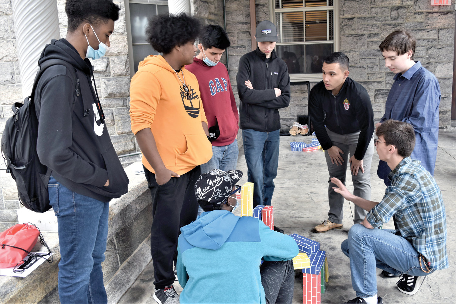a group of visitors participate in a team-building exercise with seminarian Brandon Guizar at St. Joseph’s Day for Vocations held on the Feast of St. Joseph, March 19, at St. Joseph’s Seminary in Dunwoodie. It was one of four workshops led by seminarians.