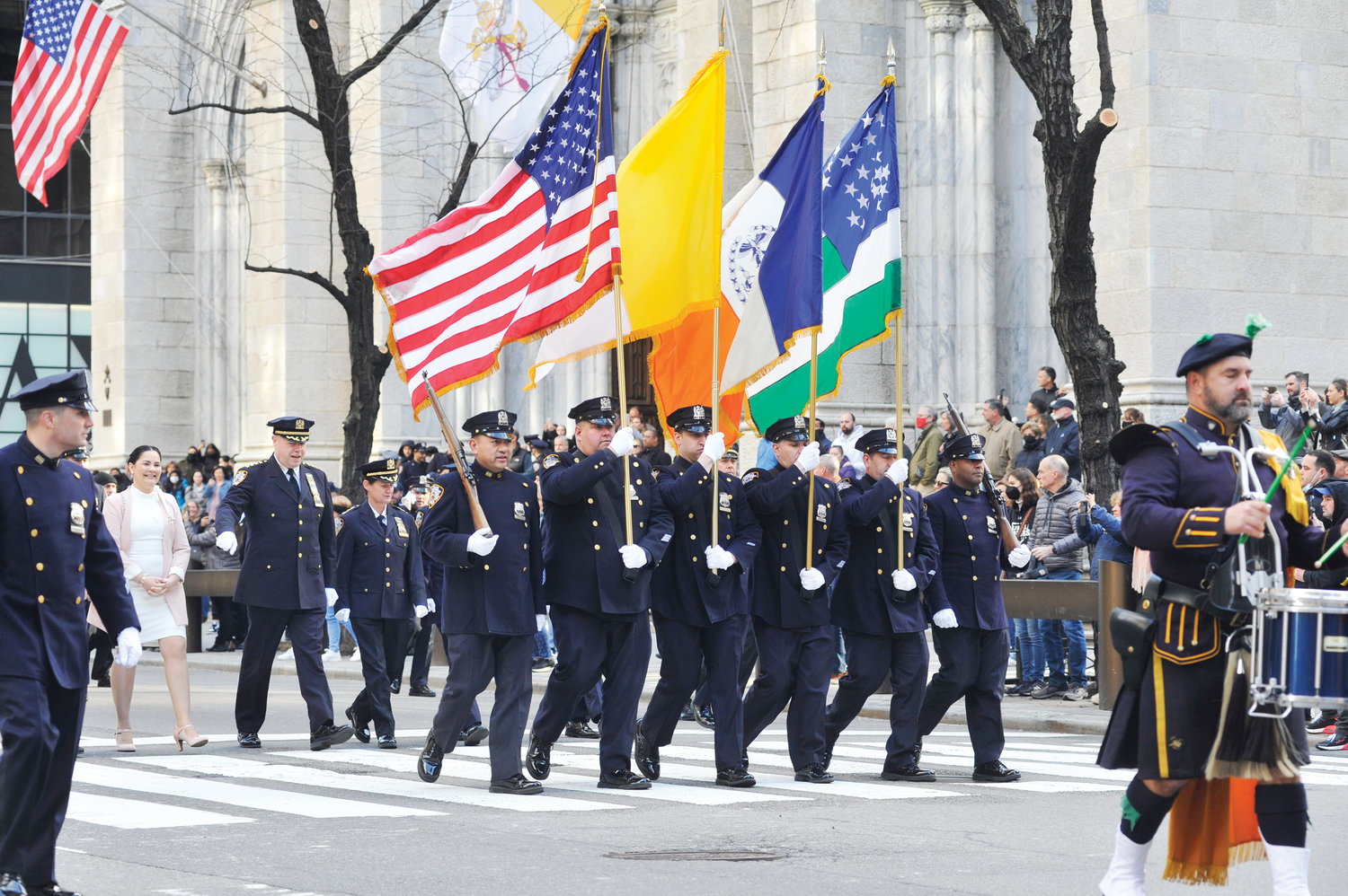 Flag bearers march along Fifth Avenue outside St. Patrick’s Cathedral where Cardinal Dolan celebrated the annual Mass for the NYPD Holy Name Society of Manhattan, Bronx and Staten Island March 27.