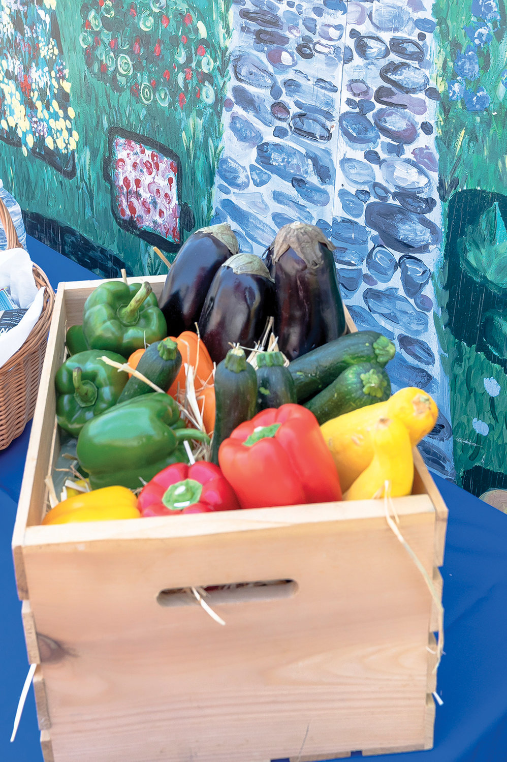 A box of vegetables is displayed.