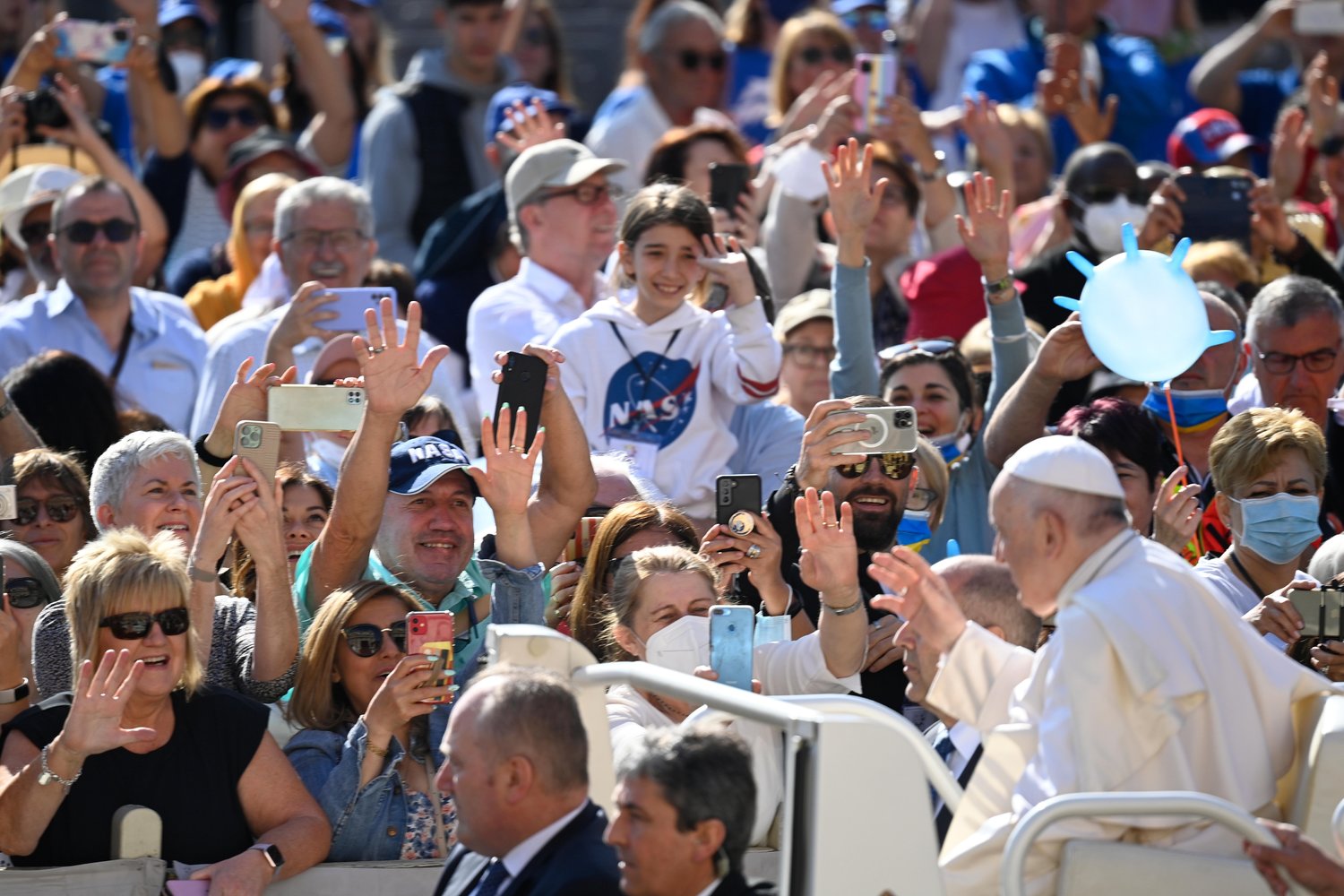Pope Francis greets people as he arrives for his general audience in St. Peter’s Square at the Vatican May 11.