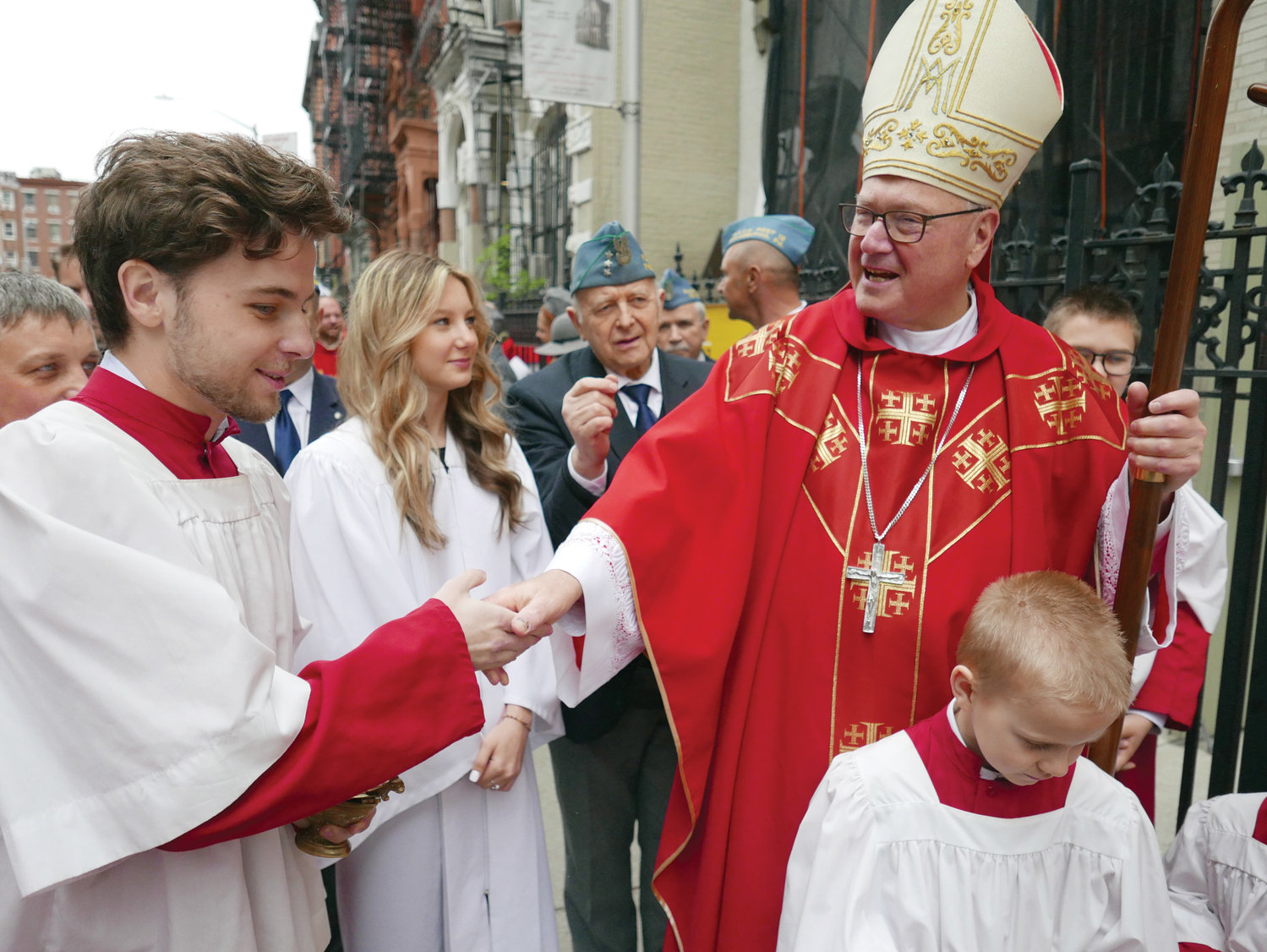 Cardinal Dolan greets the faithful outside St. Stanislaus Bishop and Martyr Church in Manhattan’s East Village before celebrating Mass for the parish’s 150th jubilee May 8.
