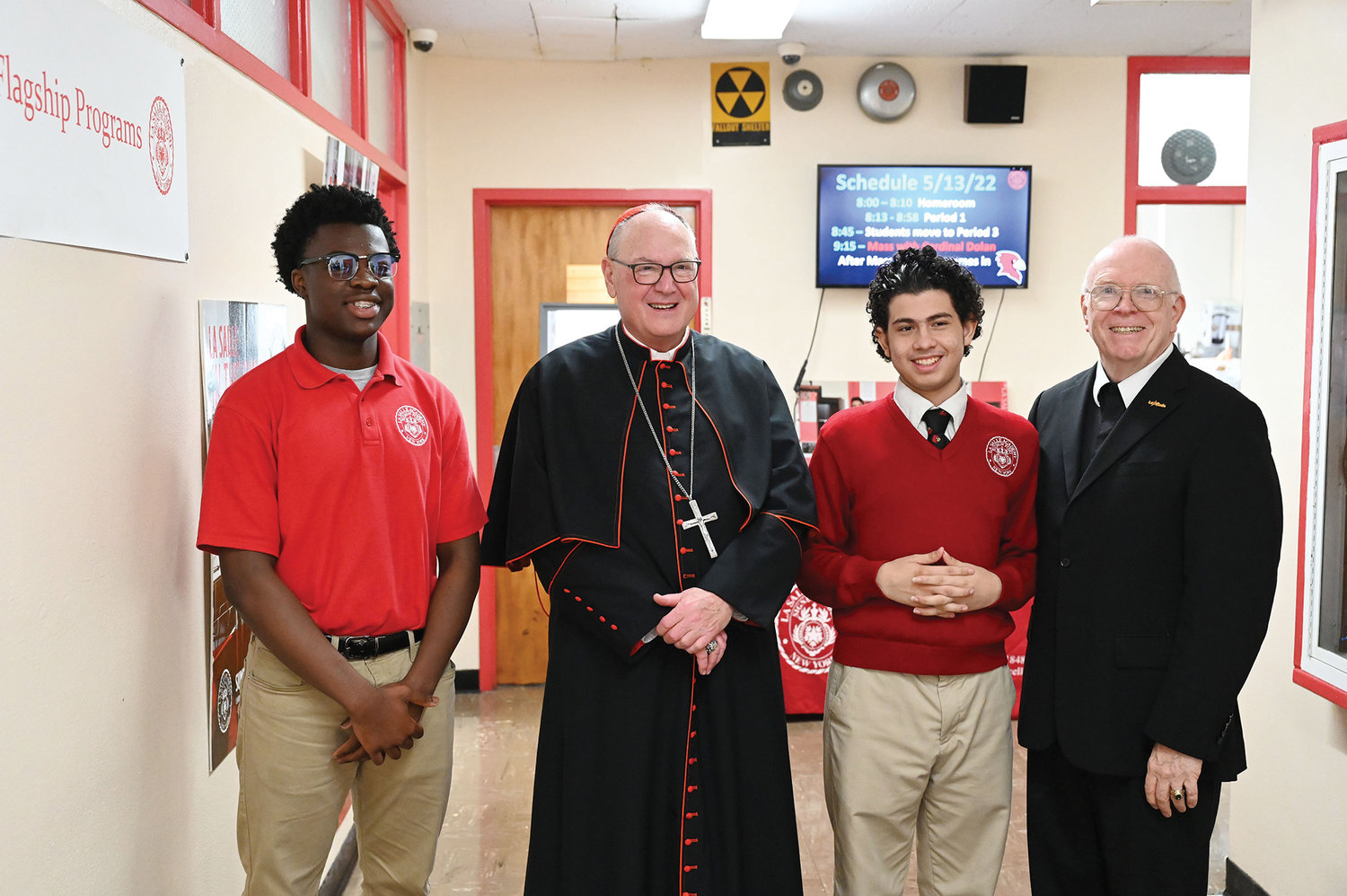 Cardinal Dolan joins Jeffrey Acquaah, Rowan Torres and Brother Thomas Casey, F.S.C., president of LaSalle Aacaemy, during his visit to the Manhattan high school May 13. The cardinal’s visit coincided with a celebration of the Feast of St. Jean Baptiste de La Salle, the school patron, May 15.