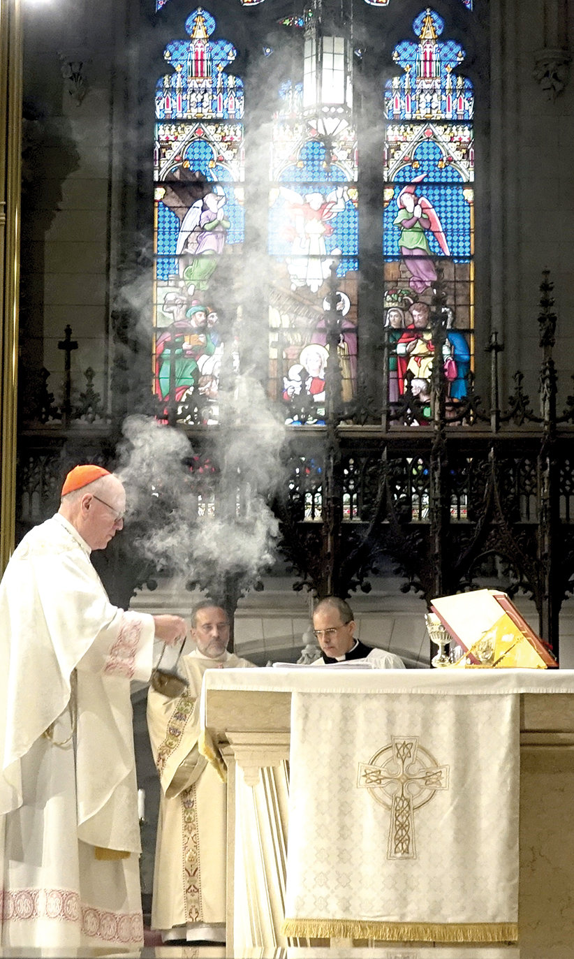 SOLIDARITY—Cardinal Dolan incenses the altar during the Synodal Unity Mass of Thanksgiving he offered May 15 at St. Patrick’s Cathedral.