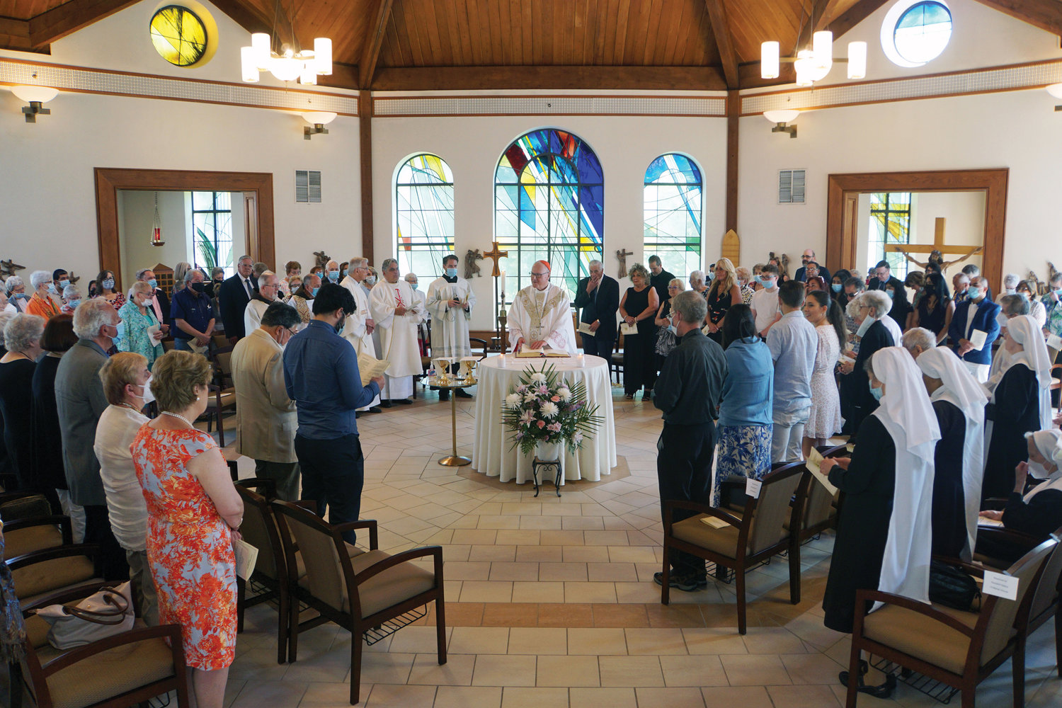 FILLED WITH COMMUNITY—Sisters from six religious communities now live in retirement at Marian Woods in Hartsdale where Cardinal Dolan, top, offered Mass in the chapel to mark the convent’s 20th anniversary.