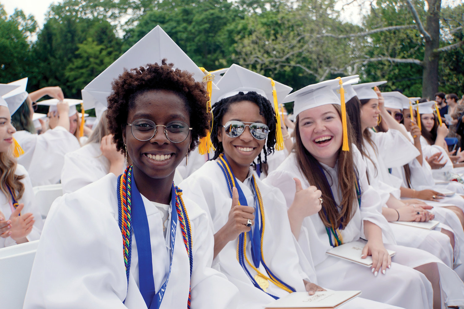 Twins Jannett Martiena and Jennipher Martiena, and fellow graduate Emily Mays light up 125th annual commencement exercises at The Ursuline School in New Rochelle May 20.
