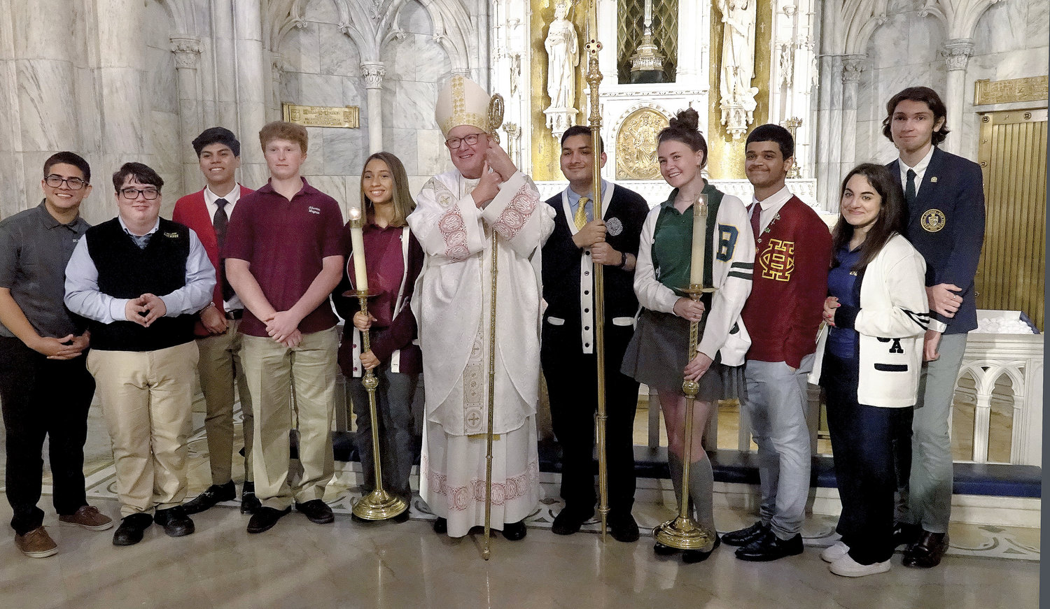 Cardinal Dolan greets seniors from Catholic high schools in the archdiocese who served at the Mass he offered for the Class of 2022 May 18 at St. Patrick’s Cathedral, the second time that week he had done so.