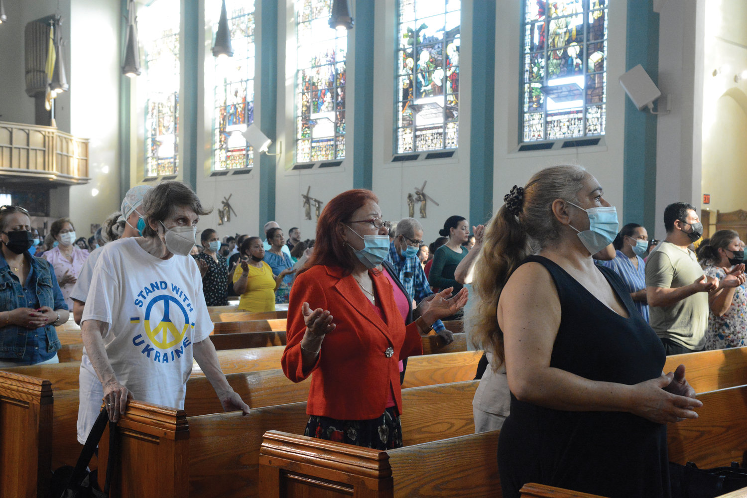 Parishioners pray during the Mass celebrated by Cardinal Dolan at St. John-Visitation Church in the Bronx May 21.