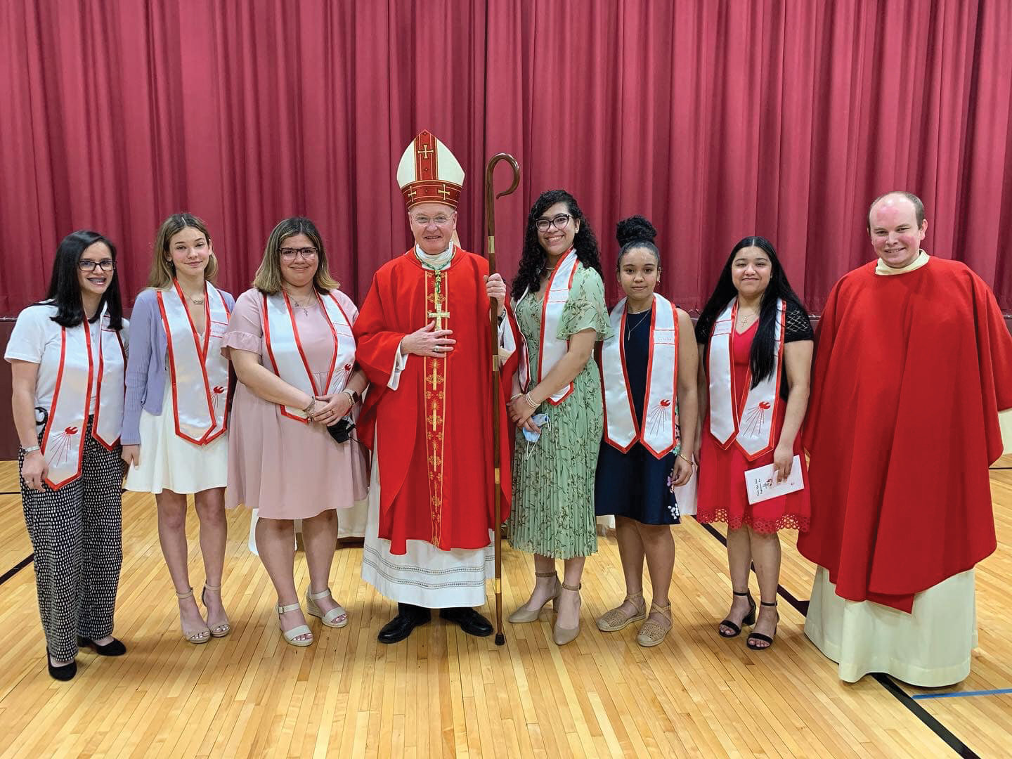 Six Preston High School students received the sacrament of confirmation May 19 at a Mass celebrated by Auxiliary Bishop Edmund Whalen and concelebrated by Father Paul Richmond, O. Carm., parochial vicar of St. Simon Stock parish in the Bronx. From left are Leidy Notaro, Christa Petriello, Maely Mercado, Bishop Whalen, Scarlett Hartman, Clara Suriel, Melissa Aquino and Father Richmond.