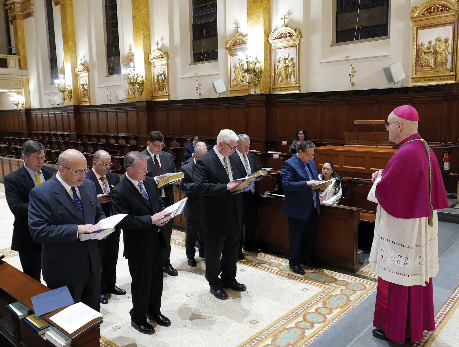 Auxiliary Bishop James Massa, rector of St. Joseph’s Seminary, Dunwoodie, leads the 10 men who will be ordained to the permanent diaconate Saturday, June 18, in the Call to the Order of Deacon in the seminary chapel. The May 10 ceremony included an oath of fidelity and profession of faith.