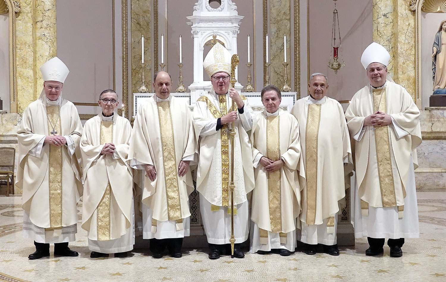 GOLDEN JUBILARIANS—Members of the Ordination Class of 1972 join Auxiliary Bishop Edmund Whalen, left; Cardinal Dolan and Auxiliary Bishop John Bonnici, right. Marking their jubilees are, from left: Msgr. Thomas Derivan, Father Robert DeJulio, Father Robert Grippo and Father John Vigilanti.