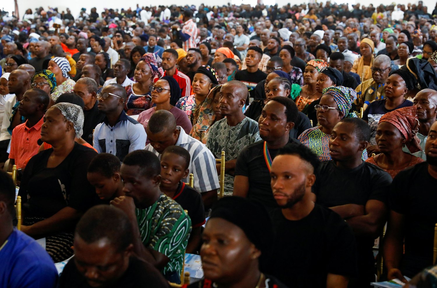 Hundreds attend a Funeral Mass in the parish hall of St. Francis Xavier Church in Owo, Nigeria, June 17.