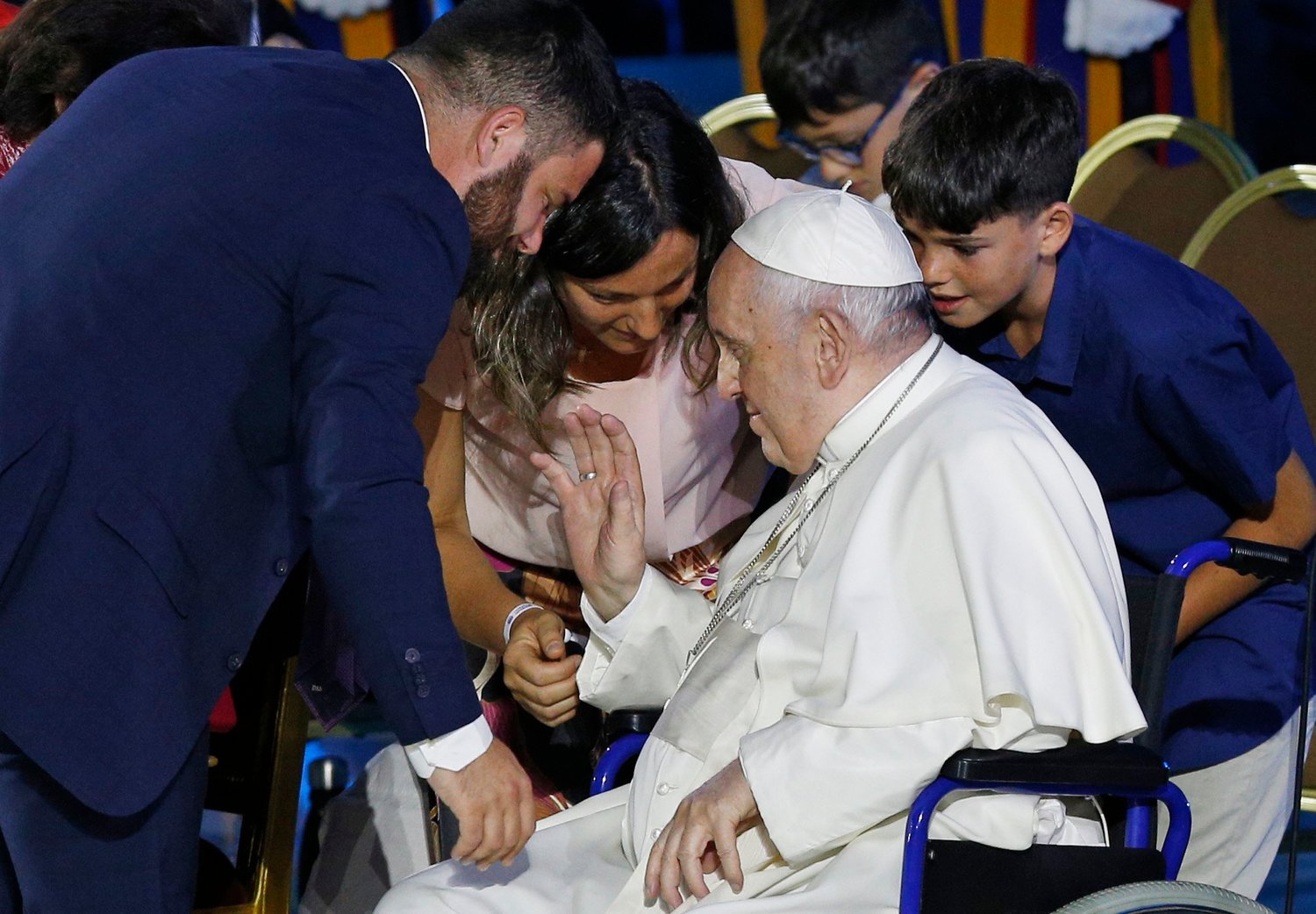 Pope Francis blesses Pietro and Erika Chiriaco, who are hosting a Ukrainian family in Italy, as he opens the World Meeting of Families in the Paul VI hall at the Vatican June 22.