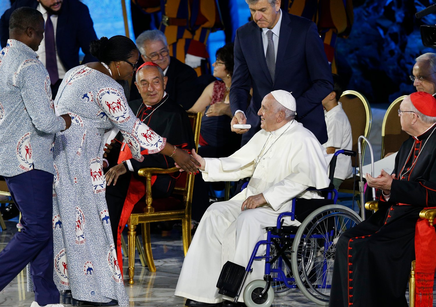 Pope Francis greets Paul and Germaine Balenza of Congo after the couple spoke at the opening of the World Meeting of Families in the Paul VI hall at the Vatican June 22.