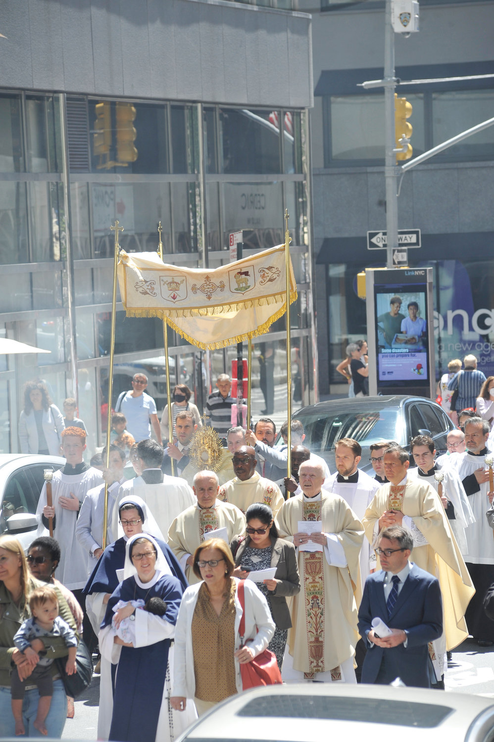 The faithful participated through prayerful witness throughout the procession, which wound around the perimeter of the cathedral and concluded with Benediction on the front steps at the cathedral’s bronze doors.