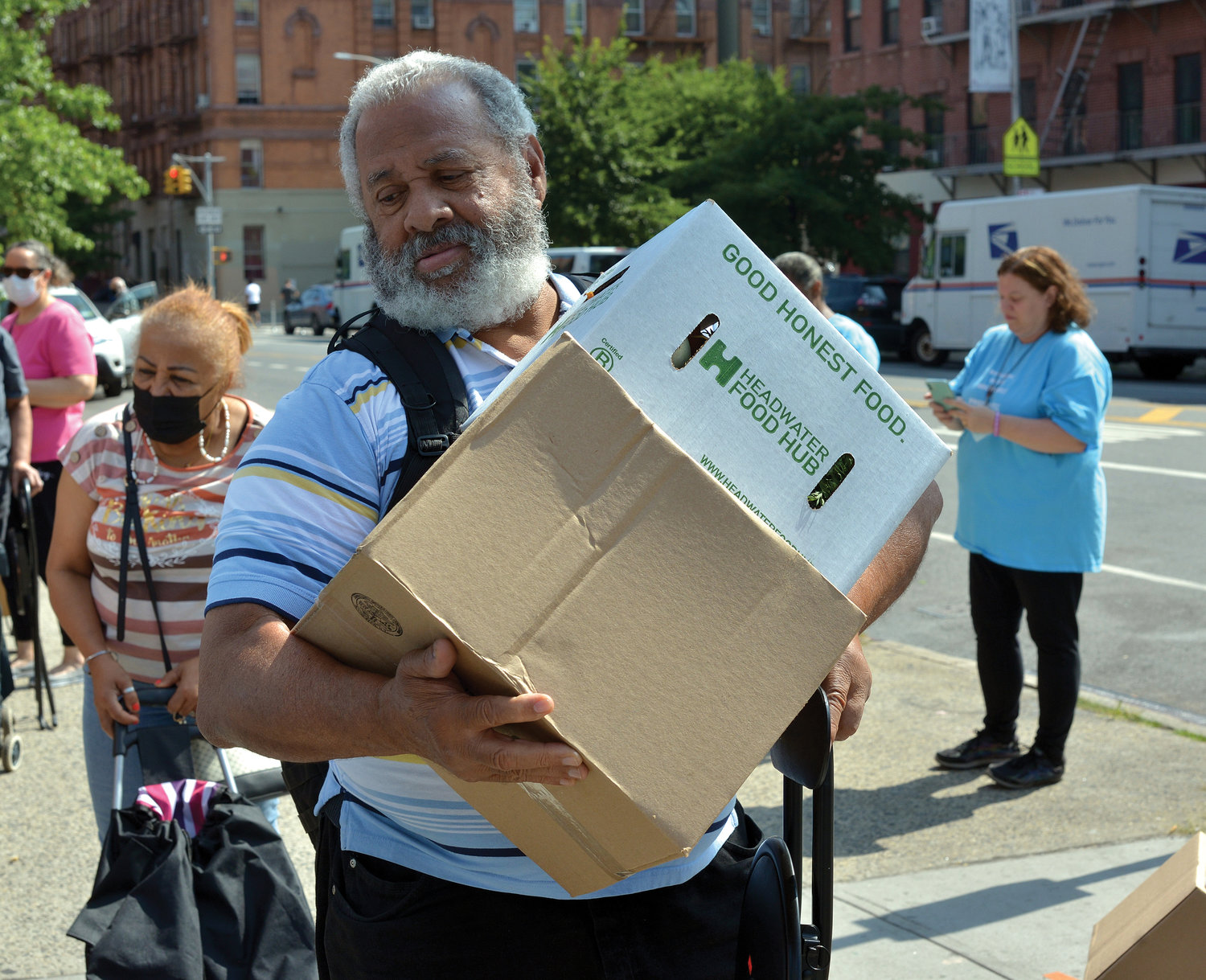 Archdiocesan Catholic Charities distributed 200 boxes of dry goods, dairy and produce July 15 to local families in need at St. Joseph of the Holy Family Church in Harlem.
