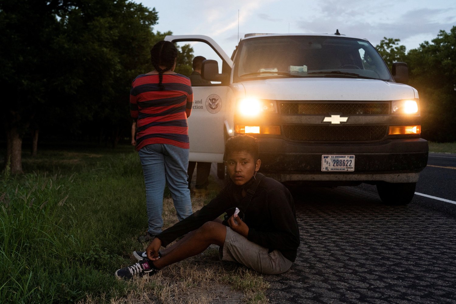 Minors from Honduras are picked up by a U.S. Customs and Border Protection agent in Eagle Pass, Texas, July 25.