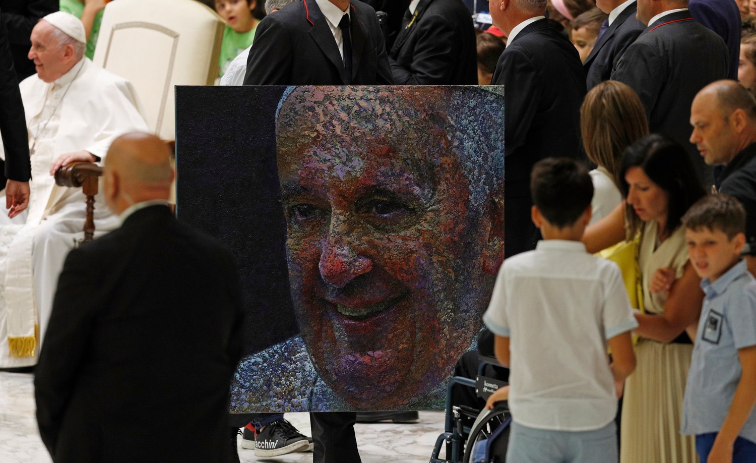 An image of Pope Francis is seen after being presented to the pope during his general audience in the Paul VI hall at the Vatican Aug. 3.