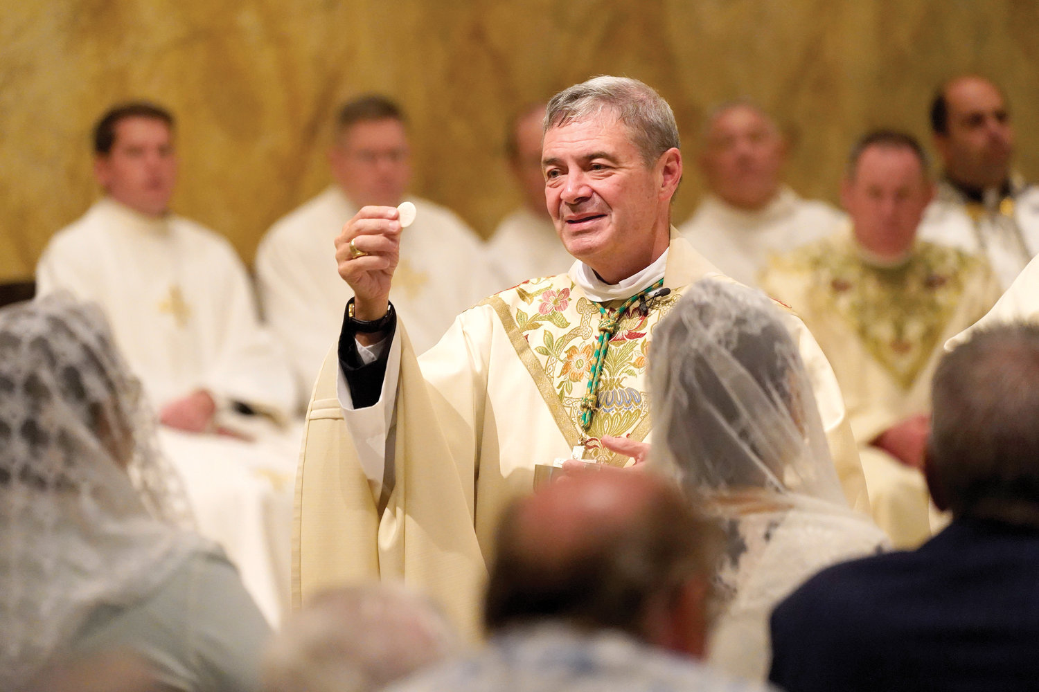 Brooklyn Bishop Robert Brennan distributes Communion at the afternoon liturgy. St. James was established in 1822 by Bishop John Connolly, O.P., of the then-Diocese of New York to serve a growing number of Catholic immigrants living in Brooklyn.