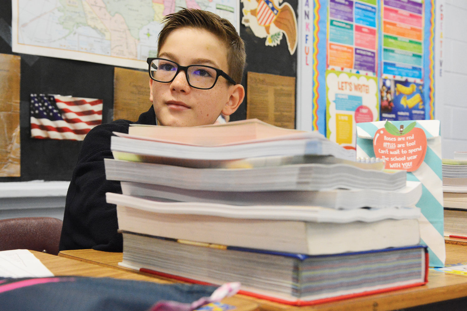 Students got right back to learning Sept. 6, the first day of classes at St. Mary’s School in Fishkill. The books were piled high in front of seventh-grader Logan Claire.