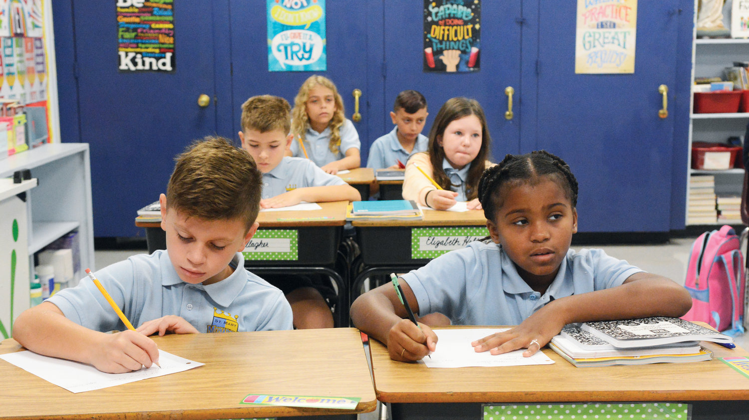 CLASSROOM STUDIES—Students got right back to learning Sept. 6, the first day of classes at St. Mary’s School in Fishkill. Fourth-graders quickly put their pencils to paper.