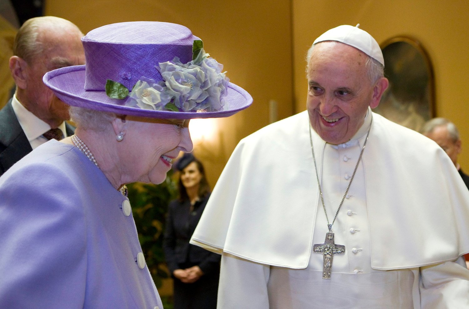 Britain’s Queen Elizabeth II talks with Pope Francis during a meeting at the Vatican in this April 3, 2014, file photo.