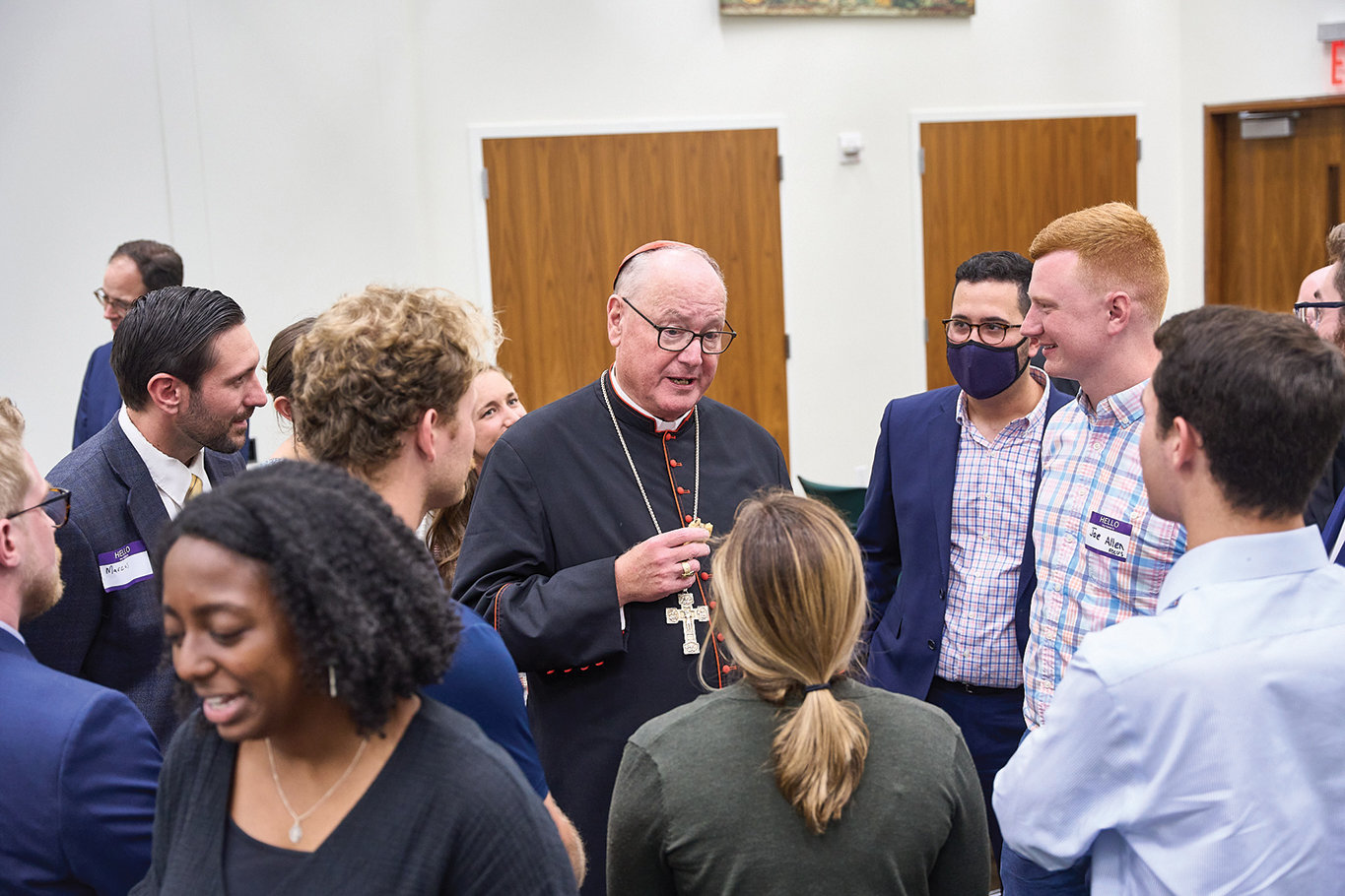 Cardinal Dolan meets students and guests at the Cardinal Egan Catholic Center at New York University in the Greenwich Village section of Manhattan Sept. 8. Cardinal Dolan’s visit came on the 10-year anniversary of the center’s dedication in Cardinal Egan’s name.