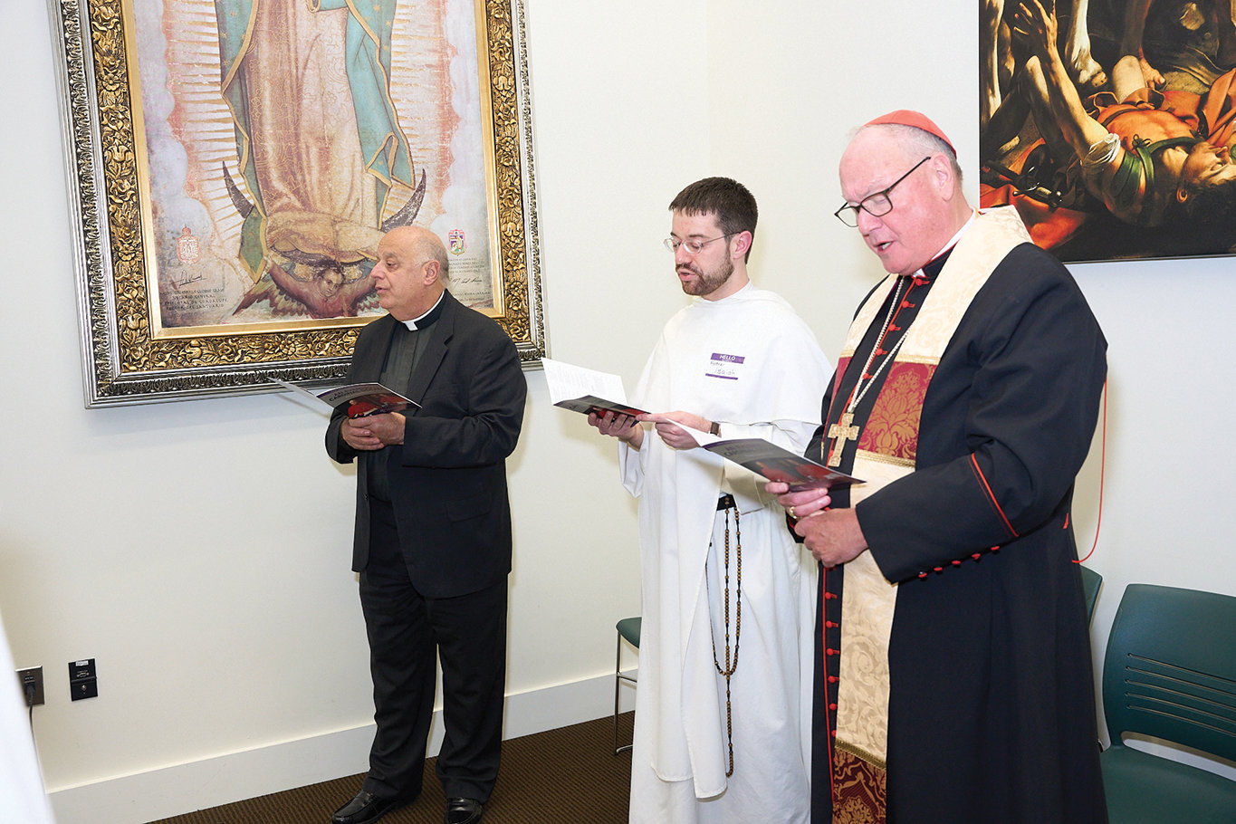Msgr. Joseph LaMorte, vicar general and moderator of the curia for the archdiocese; Father Isaiah Beiter, O.P., chaplain of the Cardinal Egan Catholic Center at NYU; and Cardinal Dolan lead students and guests at prayer during vespers.