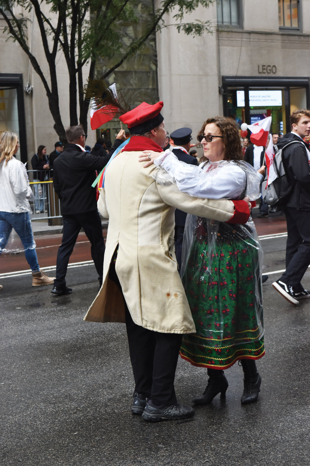 A man and a woman dance up  Fifth Avenue despite the damp weather Oct. 2 at the 85th annual Pulaski Day Parade in Manhattan.