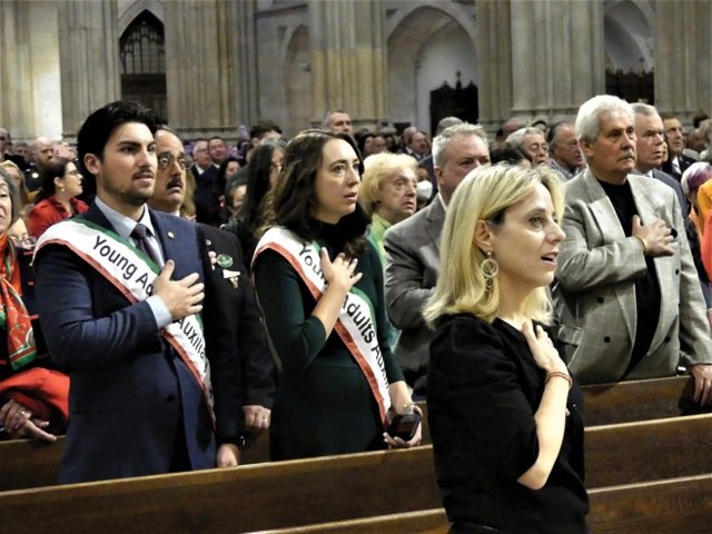 The congregation stands for the national anthems of Italy and the United States near the conclusion of the 45th annual Columbus Day Mass at St. Patrick’s Cathedral Oct. 10.