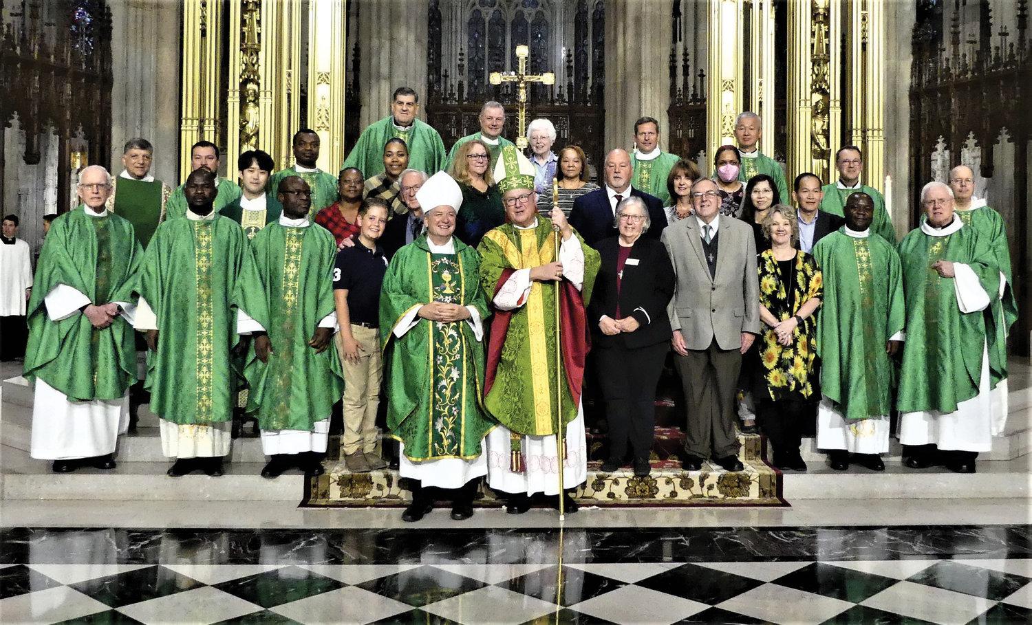 Clergy, mission leaders and staff members gather at St. Patrick’s Cathedral with Cardinal Dolan, the principal celebrant, following the Oct 23 World Mission Sunday Mass. Next to the cardinal is Archbishop Anthony Fisher, O.P., of Sydney, Australia, who was a concelebrant.